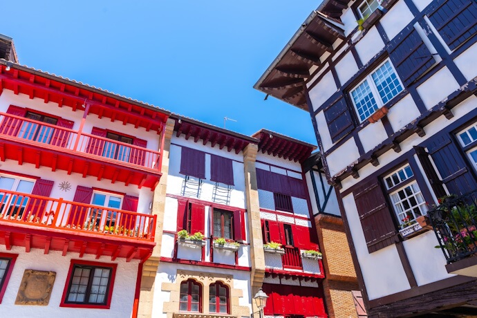 In Hondarribia, traditional Basque houses with wooden balconies and colorful shutters line the street in the Fisherman’s Quarter.