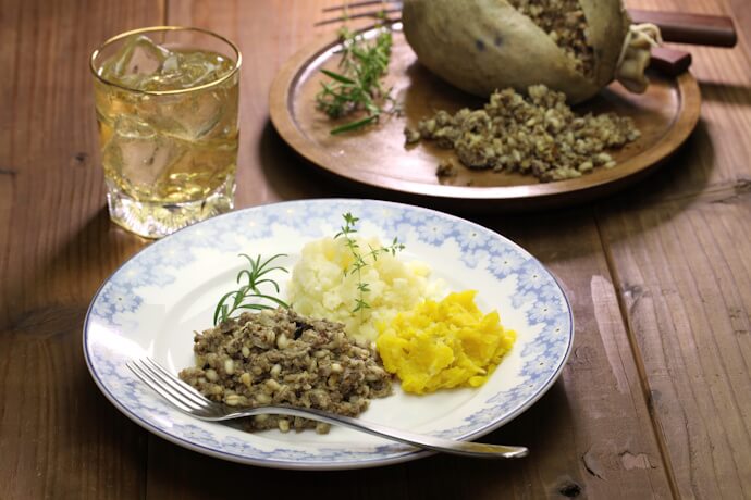 Traditional Scottish plate featuring haggis with neeps and tatties