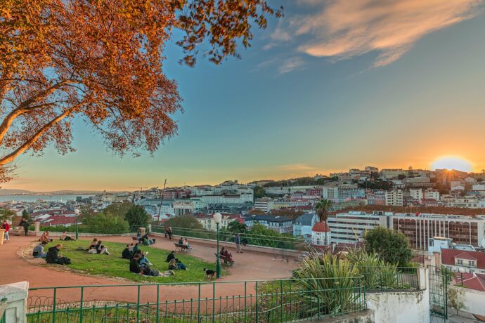 People enjoying the sunset in Jardim do Torel, Lisbon