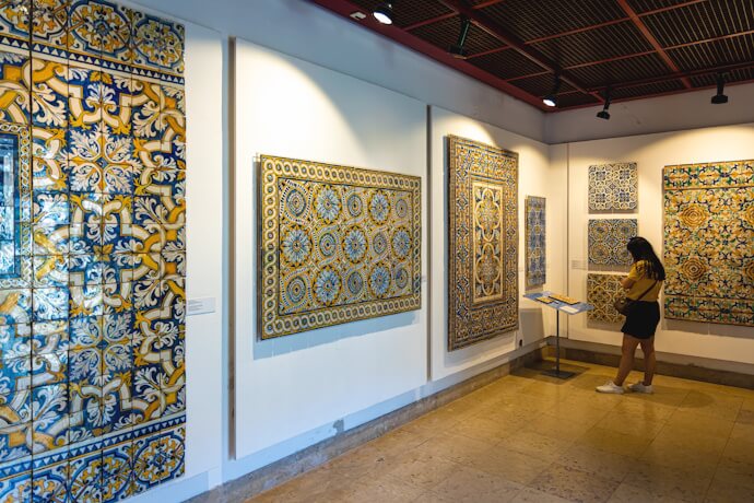 Woman admiring the displays in the Tile Museum in Lisbon