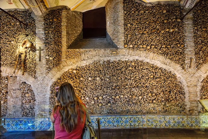 Chapel of Bones at the Church of São Francisco, with walls covered in human skulls and bones, in Évora, Portugal.