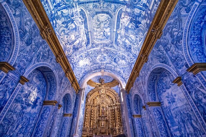Interior of the Church of São Lourenço, decorated with traditional blue-and-white azulejo tiles, in Almancil, Algarve.