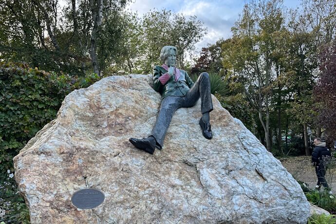 Colorful statue of Oscar Wilde in Merrion Square Park, Dublin.