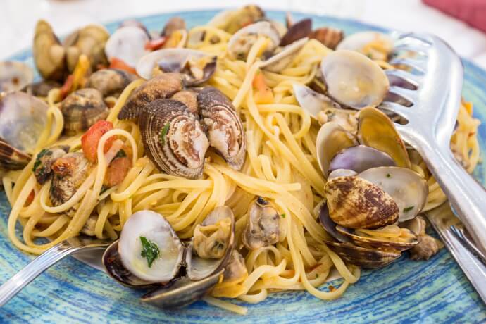 Put cheese on fish and seafood-based pasta