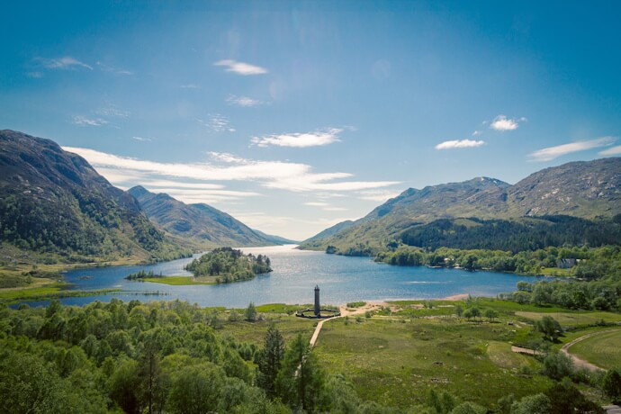 View across Loch Shiel with the Glenfinnan Monument in the foreground.