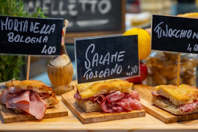 Parma ham sandwiches, bread with cured meats in the market