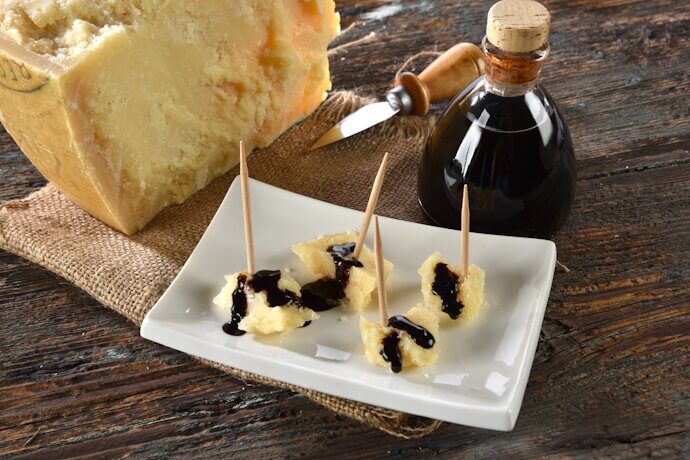 Tasting of Parma cheese with balsamic vinegar from Modena.