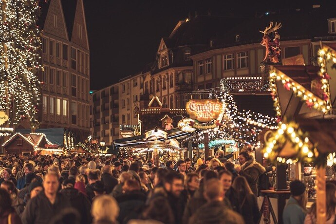 Strasbourg’s Christmas market, aglow with twinkling lights, festive wooden stalls, and the scent of mulled wine and spiced treats filling the air.