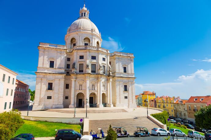 Exterior of the National Pantheon in Lisbon with its white dome and surrounding historic buildings.