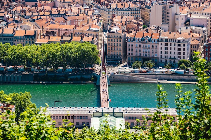Aerial view of Lyon rooftops and Rhône river bridge