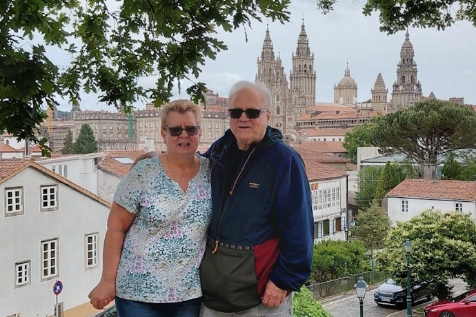 Travelers with Santiago de Compostela Cathedral in the background