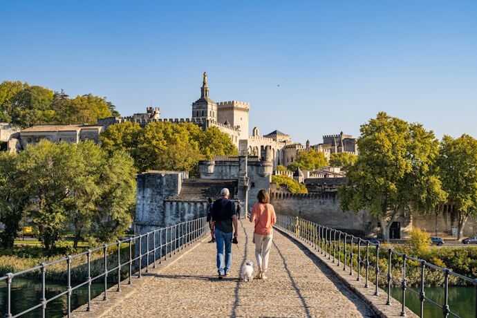 Couple crossing Pont Saint-Bénézet leading to the Palais des Papes