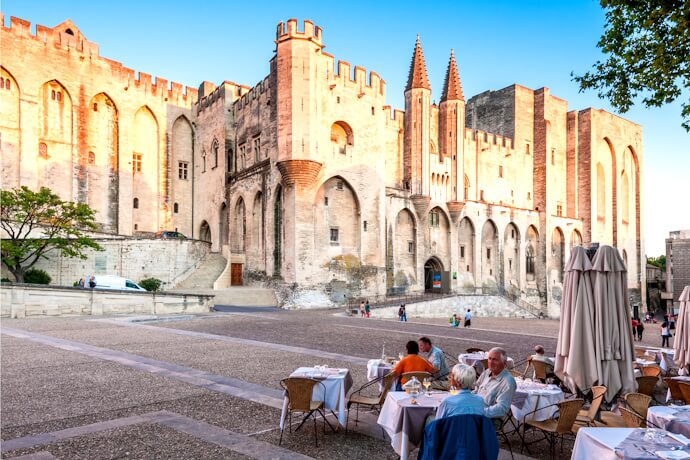 People enjoying the views of Palais des Papes in Avignon