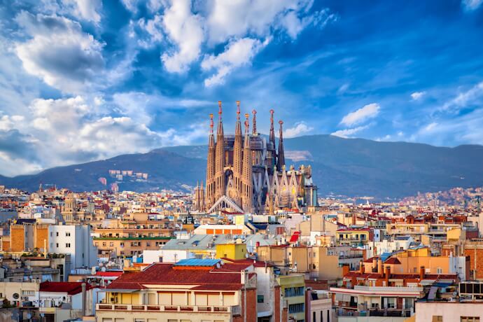 Panoramic view of the Sagrada Família rising above Barcelona's cityscape.