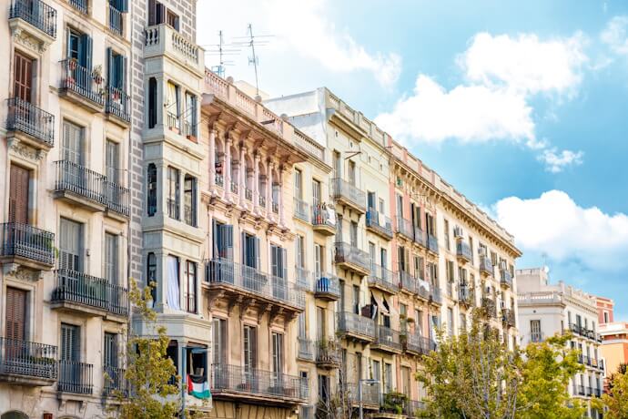 Elegant historic buildings lining the streets of Barcelona's vibrant El Born district.