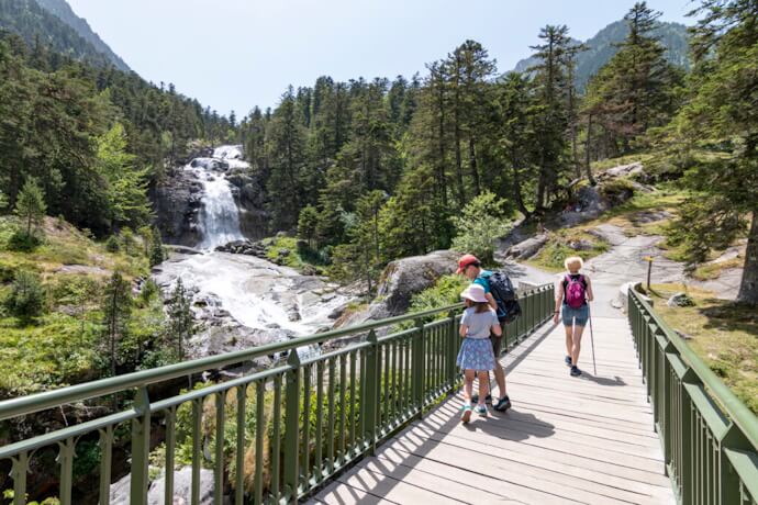 People crossing Pont d’Espagne in Cauterets, France