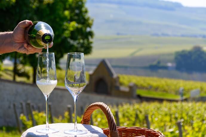 Having a taste of the French Champagne with view of the vineyards