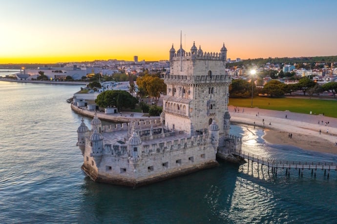 Admiring Belém Tower from the Tagus River, in Lisbon.