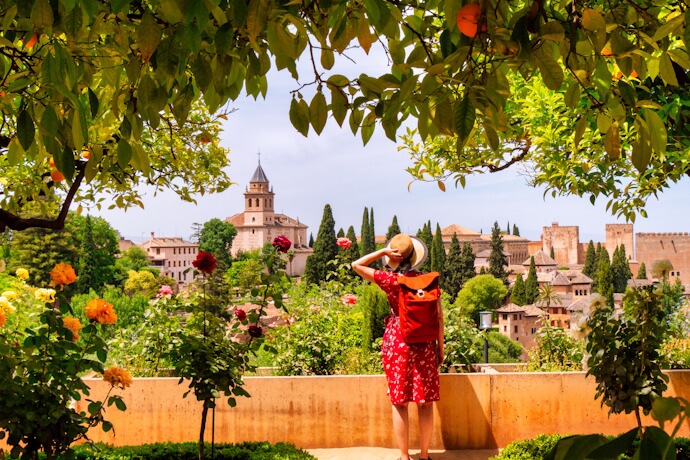 Woman at a viewpoint to Alhambra, in Granada, Spain