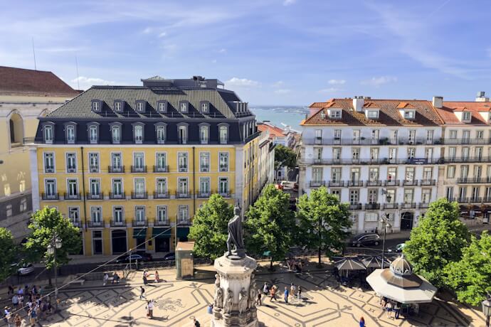 People in Luís de Camões Square, Lisbon, Portugal