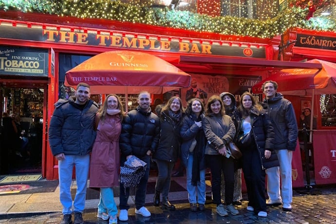 TourTailors Team posing in front of the famous Temple Bar in Dublin.