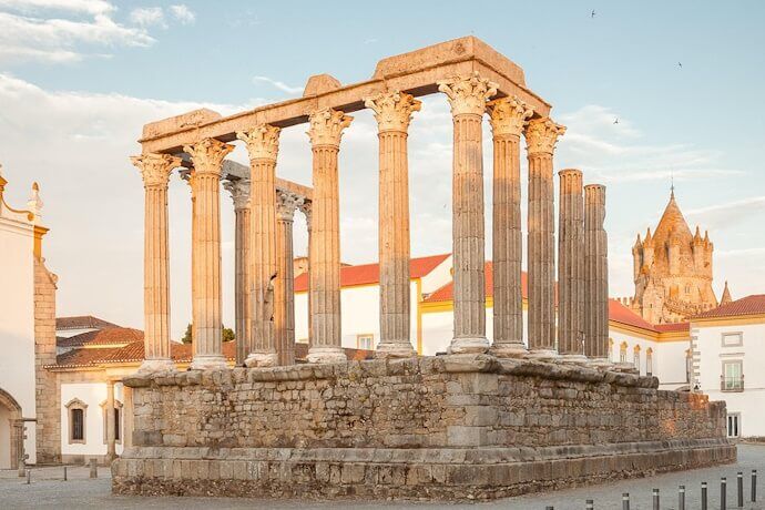 Roman Temple of Évora, also known as the Temple of Diana, with the Cathedral in the background.