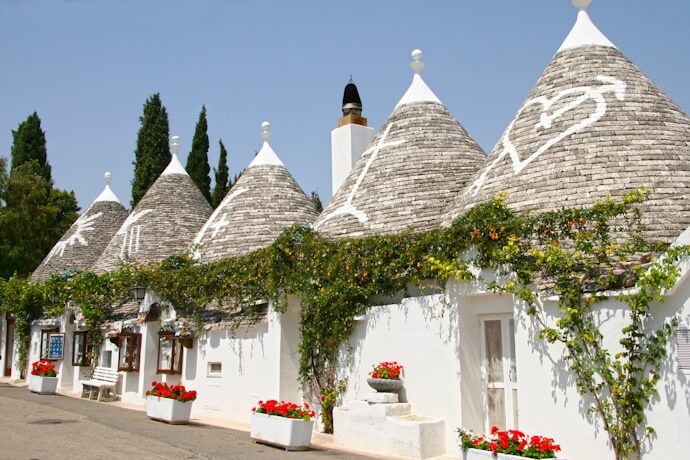 The famous Trulli of Alberobello: traditional white stone houses with conical roofs lining the historic streets of Puglia.