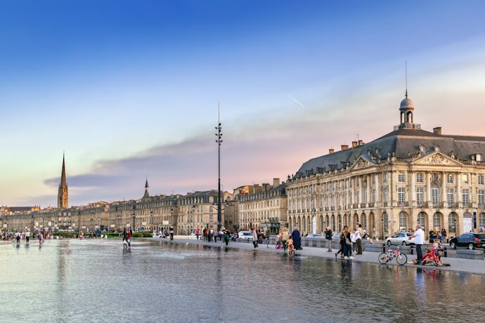 Place de la Bourse and the Miroir d’Eau reflecting historic architecture along the Garonne River in Bordeaux, France