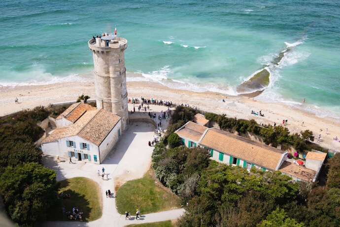 Aerial view of Phare des Baleines lighthouse and Atlantic coastline on Île de Ré, a scenic island near La Rochelle, France