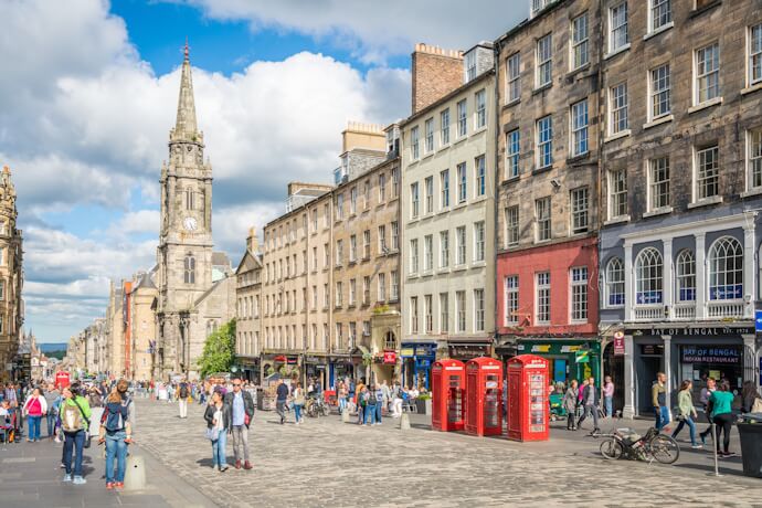 Busy street scene along Edinburghs Royal Mile with historical buildings