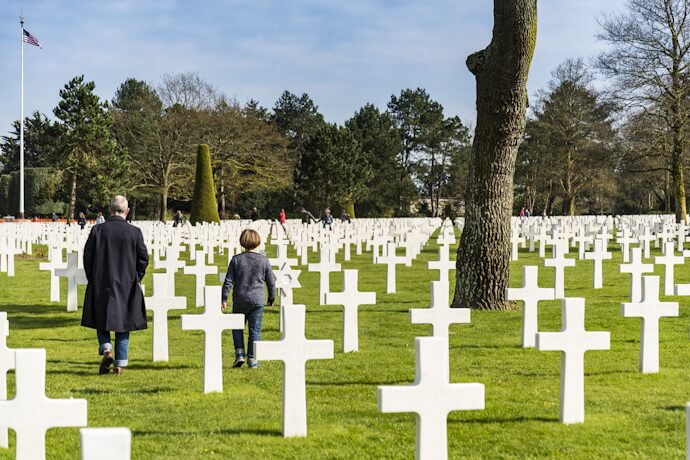 People visiting the Normandy American Cemetery in Colleville-sur-Mer, France