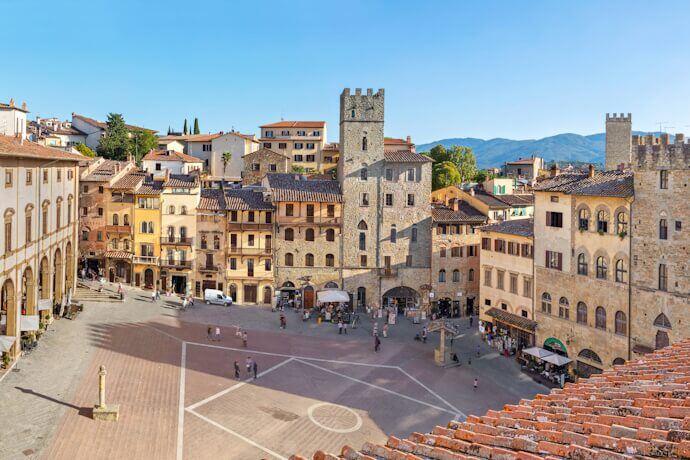 People in Piazza Grande square in Arezzo, Italy