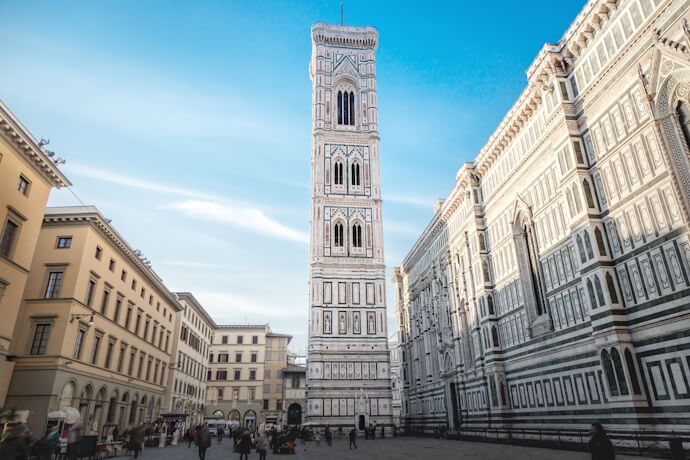 Florence’s Piazza del Duomo with the marble bell tower of Giotto and surrounding Renaissance buildings.