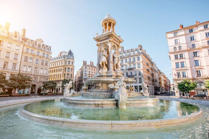 The Fountain of the Jacobins in Lyon, France, surrounded by elegant historic buildings