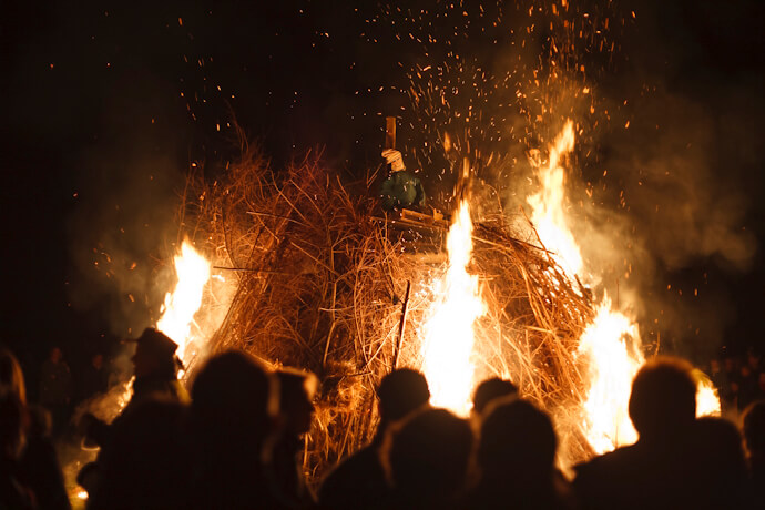 Large bonfire illuminating a nighttime festival gathering in County Meath, Ireland.
