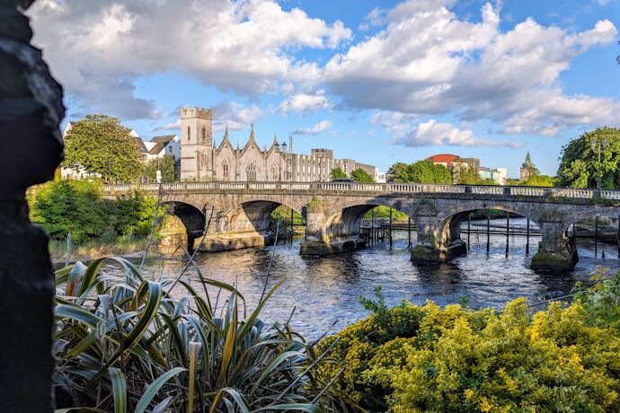 Historic stone bridge crossing the River Corrib in Galway, Ireland.