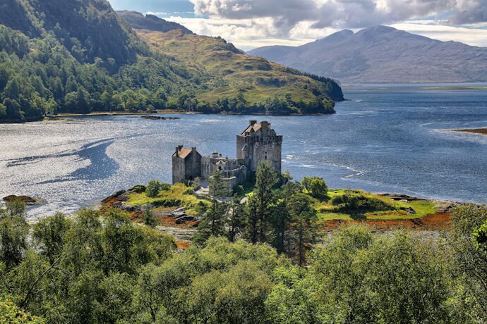 Eilean Donan Castle surrounded by Loch Duich and Scotland's mountainous Highlands