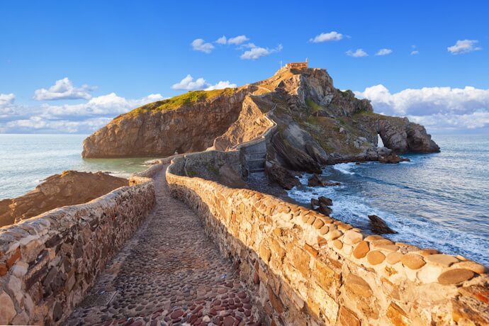 San Juan de Gaztelugatxe island connected to the mainland by a winding stone bridge