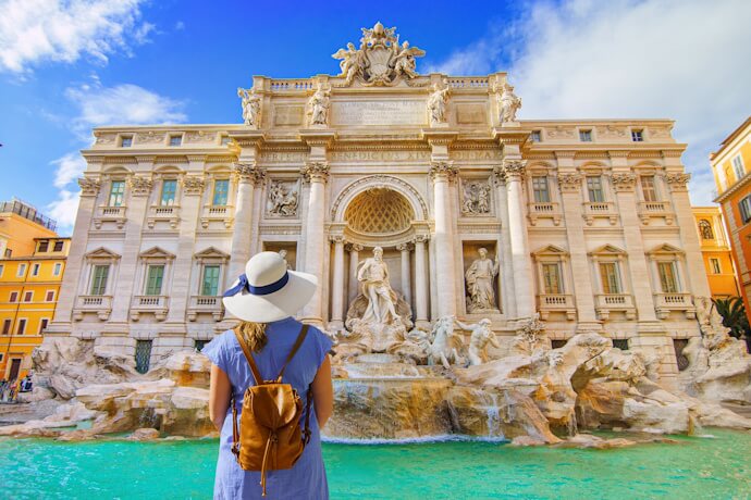 Traveler admiring the Trevi Fountain in Rome
