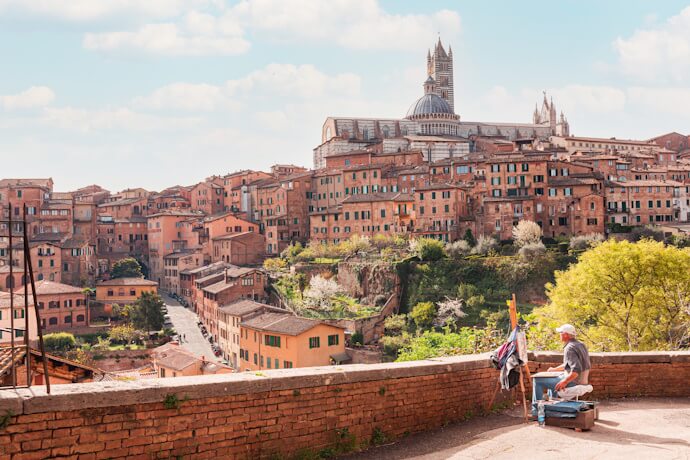 Painter overlooking Siena’s historic city center