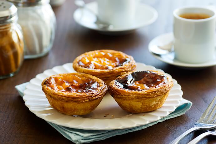 Pastéis de nata served with coffee in Portugal.