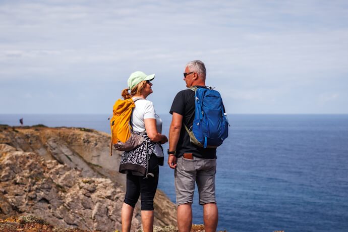 Couple hiking along Portugal’s Atlantic coastline.