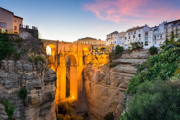 Puente Nuevo bridge spanning the gorge in Ronda at sunset