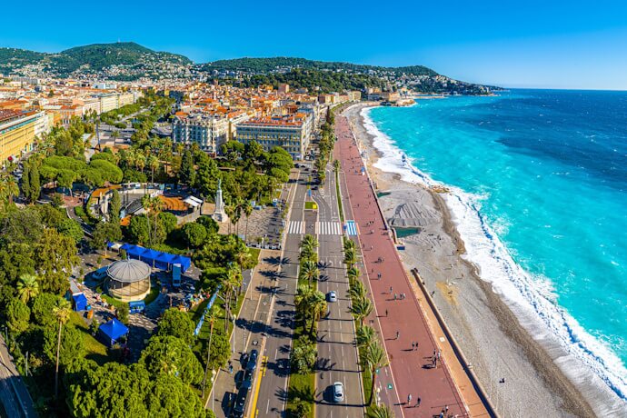 Seaside promenade with view of Nices vibrant cityscape