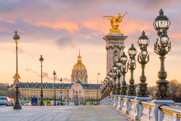 A breathtaking view of the Pont Alexandre III bridge in Paris at sunset