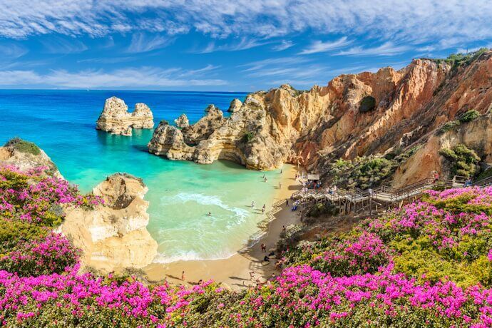 People enjoying a sunny day in Praia do Camilo, Algarve