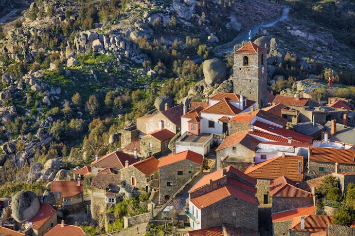 Traditional stone houses and church tower in the mountain village of Loriga, Serra da Estrela.