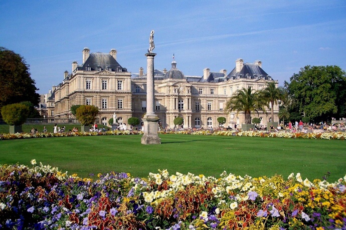 People enjoying a sunny day at the Luxembourg Gardens in Paris