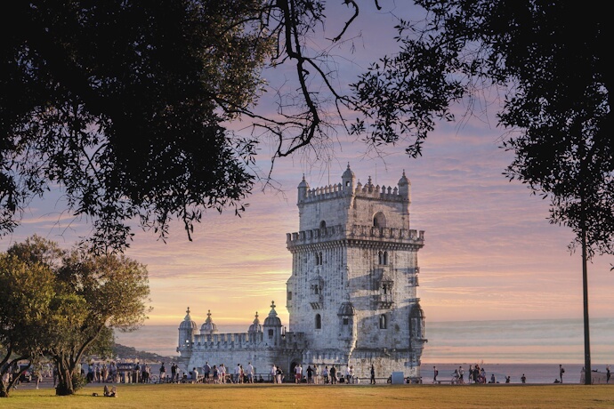 People enjoying the sunset in Lisbon, near Belém Tower