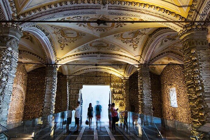 People visiting the Bones Chapel in Évora, Portugal